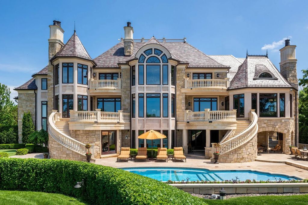 3770 Northome Road Home in Wayzata, Minnesota. Discover the epitome of luxury living on Lake Minnetonka with this John Kraemer & Sons masterpiece. From the luxurious master suite to the state-of-the-art amenities including a bowling alley, golf simulator, and Cavern Music Club, no detail has been overlooked. 