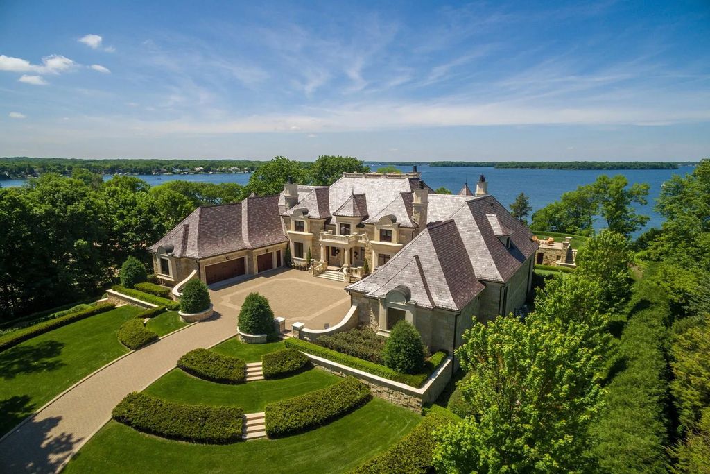 3770 Northome Road Home in Wayzata, Minnesota. Discover the epitome of luxury living on Lake Minnetonka with this John Kraemer & Sons masterpiece. From the luxurious master suite to the state-of-the-art amenities including a bowling alley, golf simulator, and Cavern Music Club, no detail has been overlooked. 