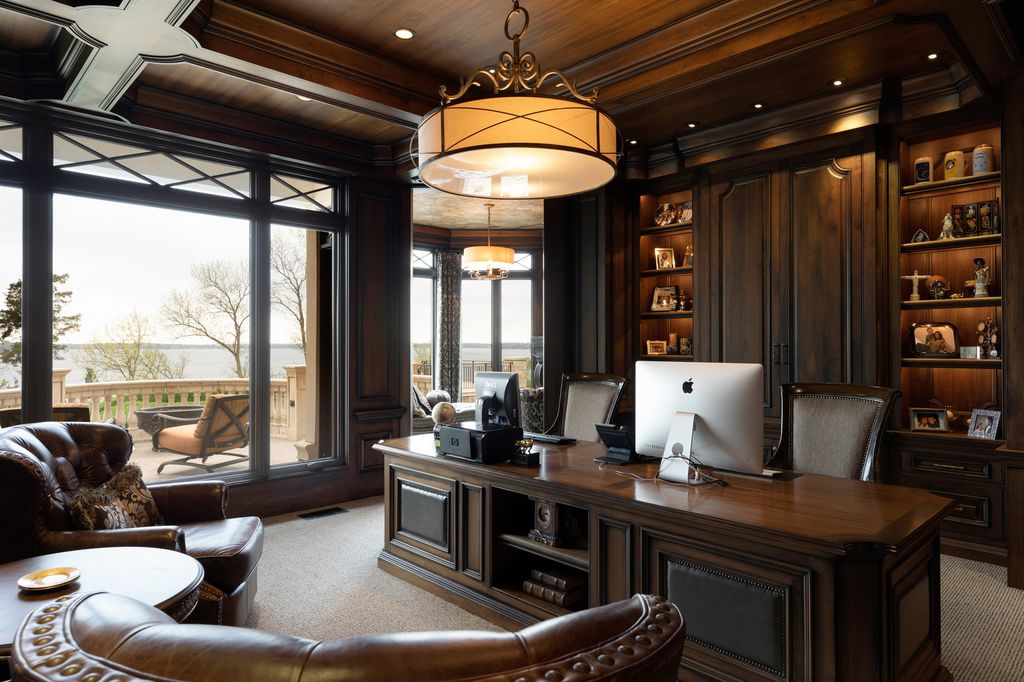 3770 Northome Road Home in Wayzata, Minnesota. Discover the epitome of luxury living on Lake Minnetonka with this John Kraemer & Sons masterpiece. From the luxurious master suite to the state-of-the-art amenities including a bowling alley, golf simulator, and Cavern Music Club, no detail has been overlooked. 