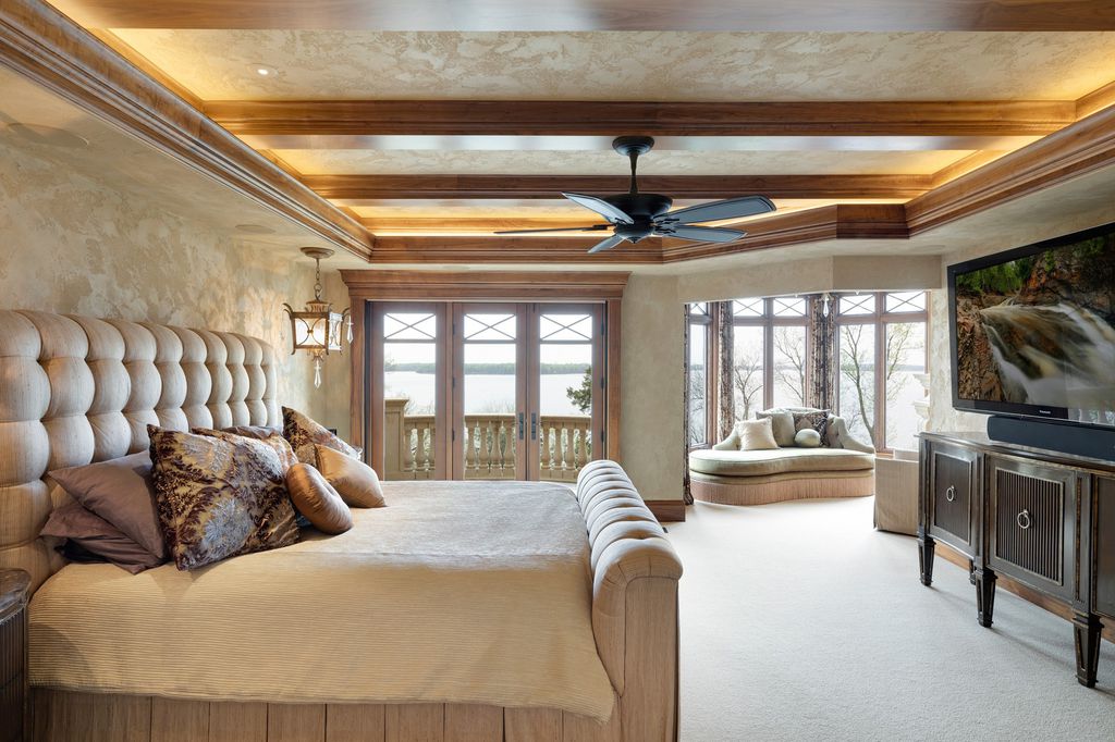 3770 Northome Road Home in Wayzata, Minnesota. Discover the epitome of luxury living on Lake Minnetonka with this John Kraemer & Sons masterpiece. From the luxurious master suite to the state-of-the-art amenities including a bowling alley, golf simulator, and Cavern Music Club, no detail has been overlooked. 