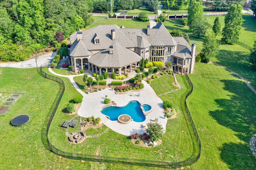 4186 N Arnold Mill Road Home in Woodstock, Georgia. Discover Stone Creek Manor, an exquisite estate offering hand-crafted elegance and olde world design in Cherokee County. Enjoy lower taxes, proximity to Roswell & Alpharetta, and easy access to local private schools and shopping.