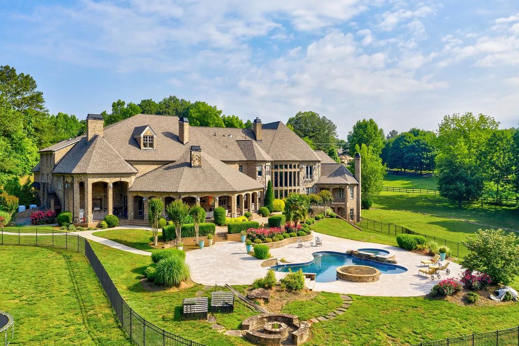 4186 N Arnold Mill Road Home in Woodstock, Georgia. Discover Stone Creek Manor, an exquisite estate offering hand-crafted elegance and olde world design in Cherokee County. Enjoy lower taxes, proximity to Roswell & Alpharetta, and easy access to local private schools and shopping.