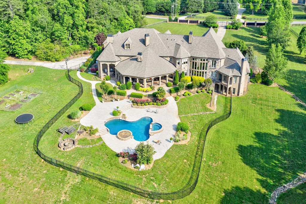 4186 N Arnold Mill Road Home in Woodstock, Georgia. Discover Stone Creek Manor, an exquisite estate offering hand-crafted elegance and olde world design in Cherokee County. Enjoy lower taxes, proximity to Roswell & Alpharetta, and easy access to local private schools and shopping.