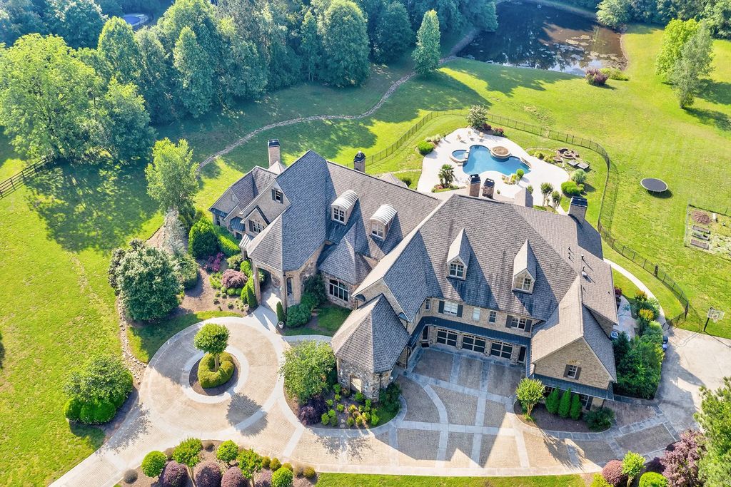 4186 N Arnold Mill Road Home in Woodstock, Georgia. Discover Stone Creek Manor, an exquisite estate offering hand-crafted elegance and olde world design in Cherokee County. Enjoy lower taxes, proximity to Roswell & Alpharetta, and easy access to local private schools and shopping.