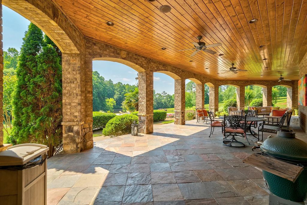 4186 N Arnold Mill Road Home in Woodstock, Georgia. Discover Stone Creek Manor, an exquisite estate offering hand-crafted elegance and olde world design in Cherokee County. Enjoy lower taxes, proximity to Roswell & Alpharetta, and easy access to local private schools and shopping.