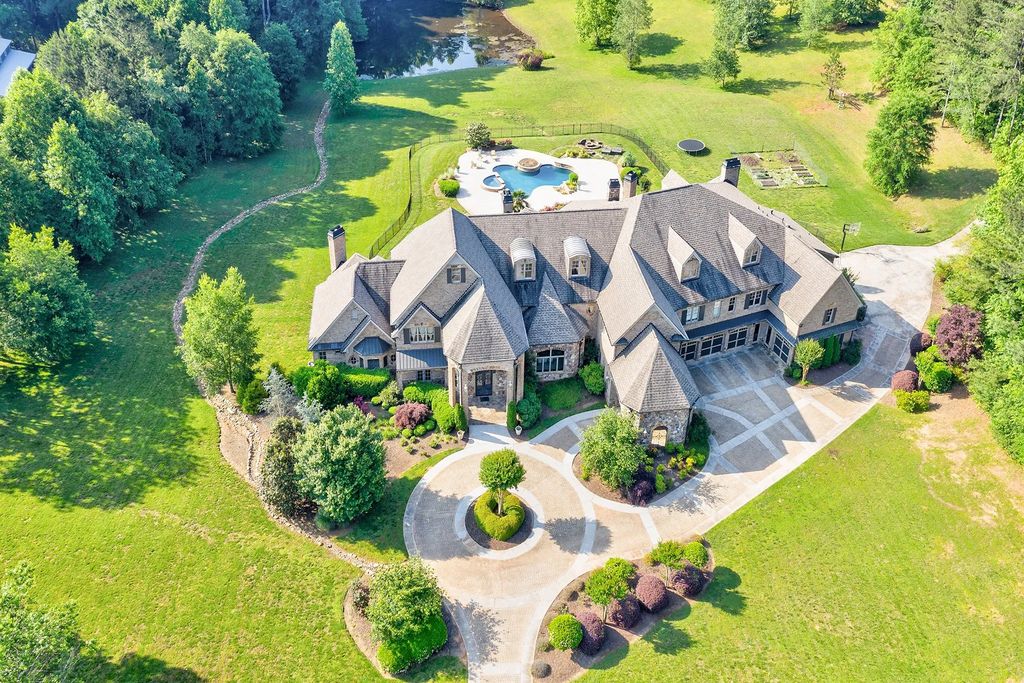 4186 N Arnold Mill Road Home in Woodstock, Georgia. Discover Stone Creek Manor, an exquisite estate offering hand-crafted elegance and olde world design in Cherokee County. Enjoy lower taxes, proximity to Roswell & Alpharetta, and easy access to local private schools and shopping.