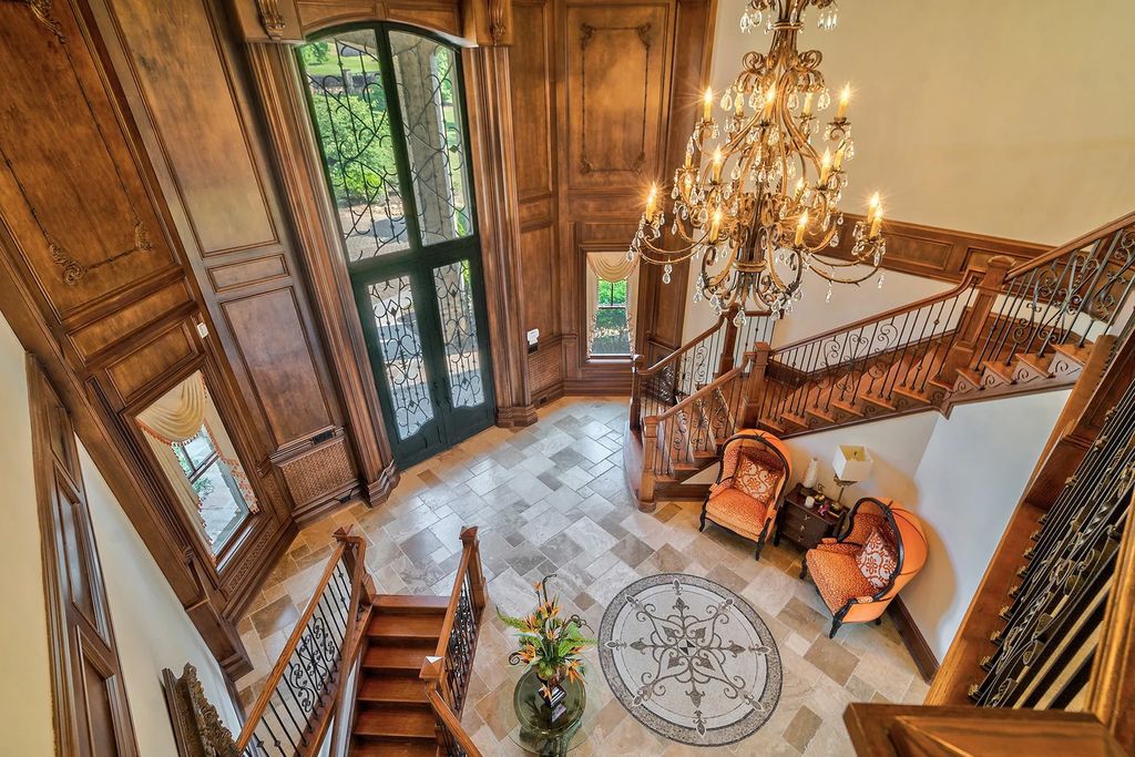 4186 N Arnold Mill Road Home in Woodstock, Georgia. Discover Stone Creek Manor, an exquisite estate offering hand-crafted elegance and olde world design in Cherokee County. Enjoy lower taxes, proximity to Roswell & Alpharetta, and easy access to local private schools and shopping.