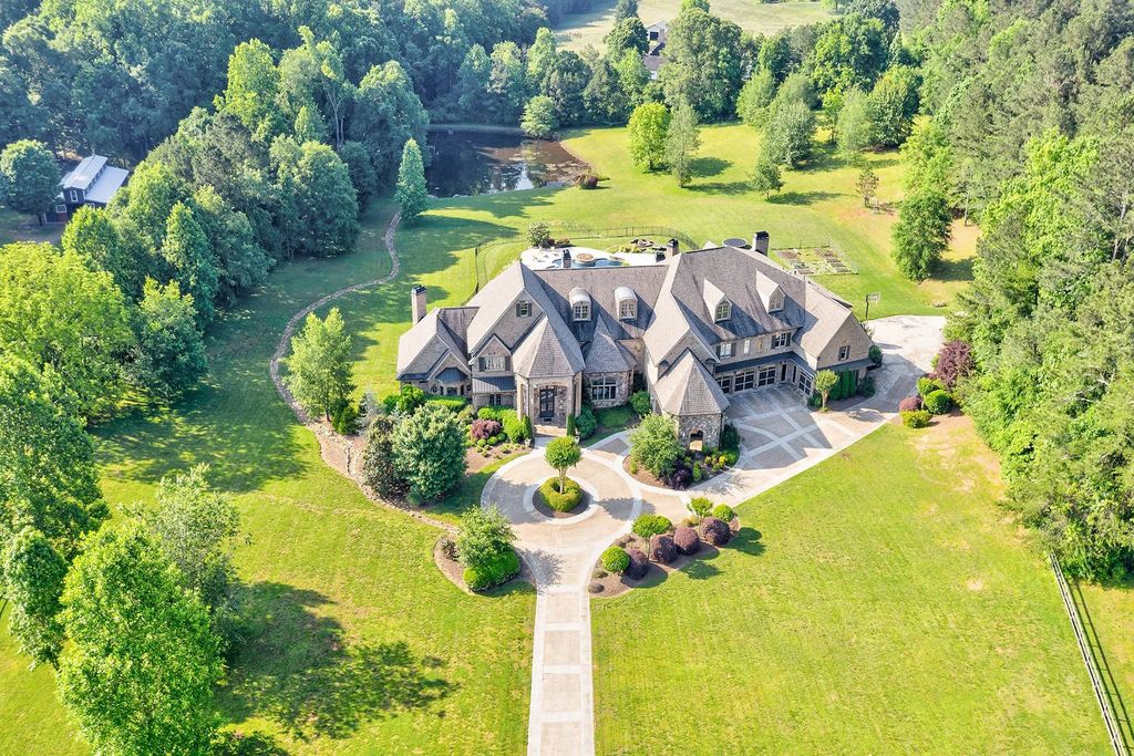 4186 N Arnold Mill Road Home in Woodstock, Georgia. Discover Stone Creek Manor, an exquisite estate offering hand-crafted elegance and olde world design in Cherokee County. Enjoy lower taxes, proximity to Roswell & Alpharetta, and easy access to local private schools and shopping.