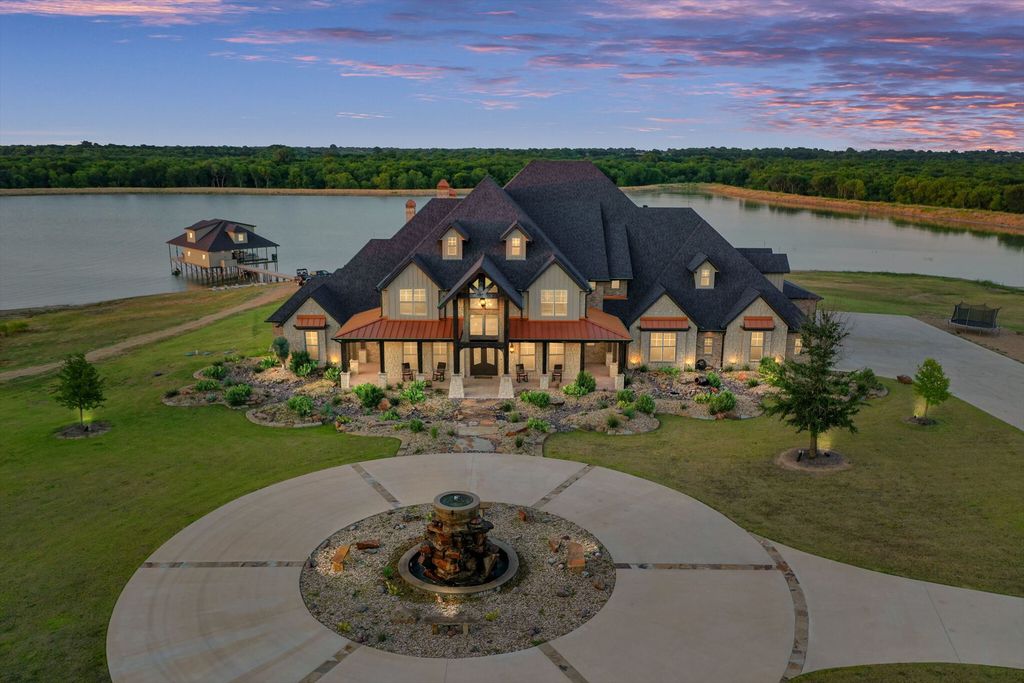 430 Chaparall Road Home in Ferris, Texas. Discover this breathtaking custom lake home nestled on 514 secluded acres, just 15 minutes south of Dallas. Meticulously constructed with stunning lake views from every room, this home features vaulted ceilings, a chef's dream kitchen, luxurious owner's suite, formal dining, study, and more. 