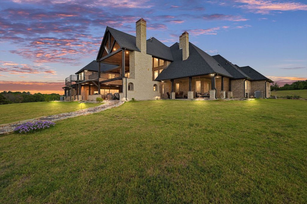 430 Chaparall Road Home in Ferris, Texas. Discover this breathtaking custom lake home nestled on 514 secluded acres, just 15 minutes south of Dallas. Meticulously constructed with stunning lake views from every room, this home features vaulted ceilings, a chef's dream kitchen, luxurious owner's suite, formal dining, study, and more. 