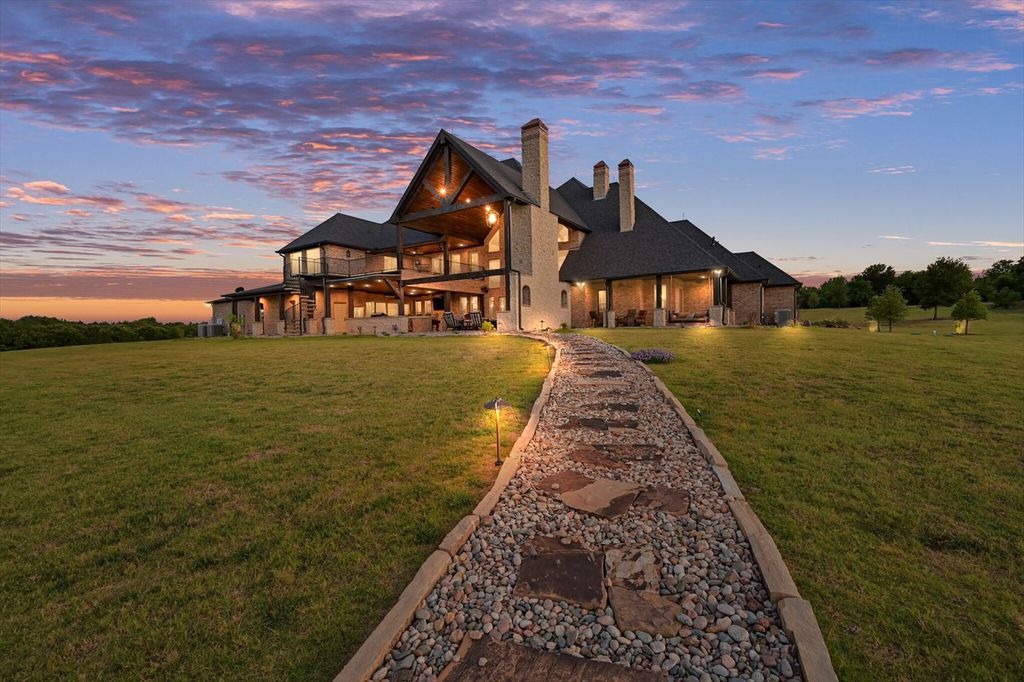 430 Chaparall Road Home in Ferris, Texas. Discover this breathtaking custom lake home nestled on 514 secluded acres, just 15 minutes south of Dallas. Meticulously constructed with stunning lake views from every room, this home features vaulted ceilings, a chef's dream kitchen, luxurious owner's suite, formal dining, study, and more. 