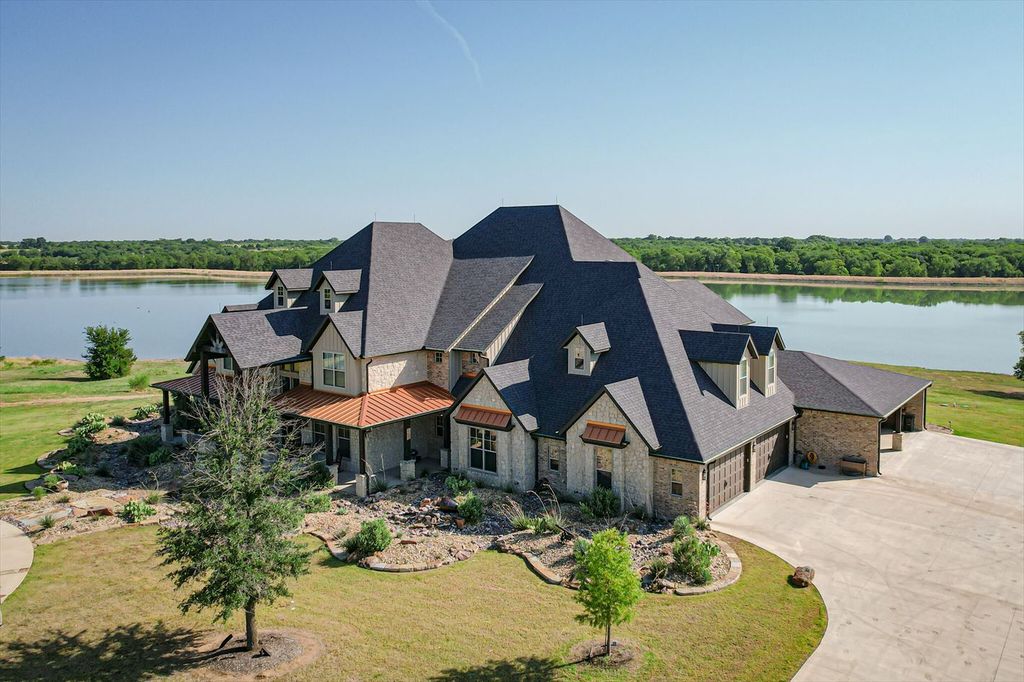 430 Chaparall Road Home in Ferris, Texas. Discover this breathtaking custom lake home nestled on 514 secluded acres, just 15 minutes south of Dallas. Meticulously constructed with stunning lake views from every room, this home features vaulted ceilings, a chef's dream kitchen, luxurious owner's suite, formal dining, study, and more. 