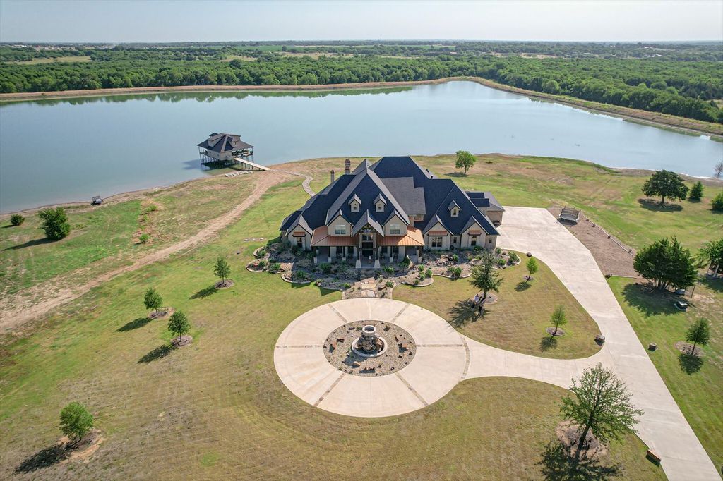 430 Chaparall Road Home in Ferris, Texas. Discover this breathtaking custom lake home nestled on 514 secluded acres, just 15 minutes south of Dallas. Meticulously constructed with stunning lake views from every room, this home features vaulted ceilings, a chef's dream kitchen, luxurious owner's suite, formal dining, study, and more. 