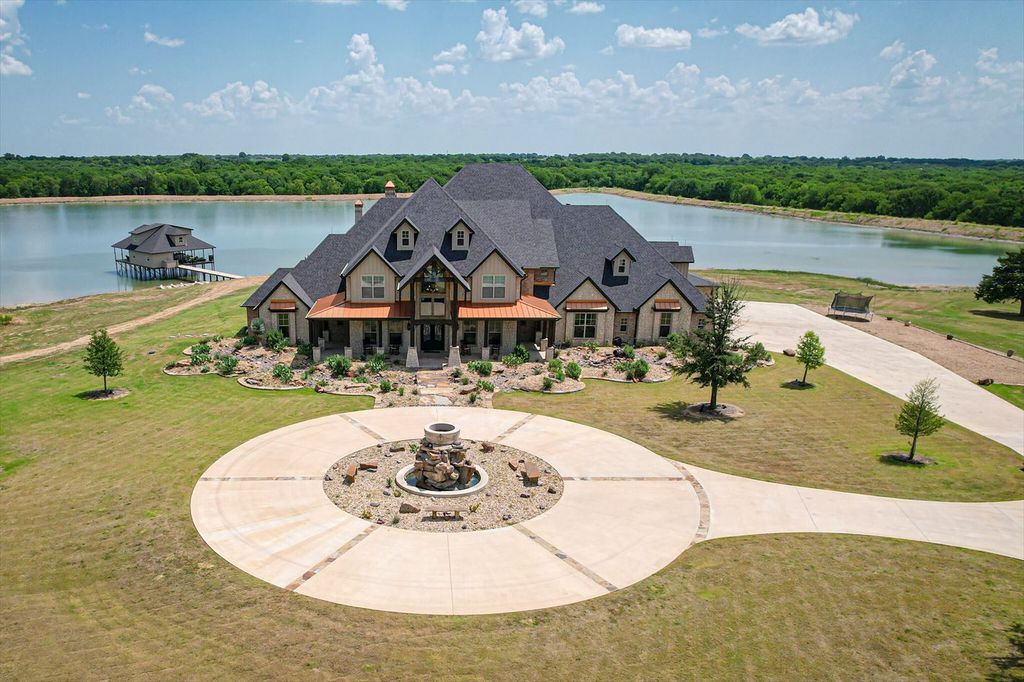 430 Chaparall Road Home in Ferris, Texas. Discover this breathtaking custom lake home nestled on 514 secluded acres, just 15 minutes south of Dallas. Meticulously constructed with stunning lake views from every room, this home features vaulted ceilings, a chef's dream kitchen, luxurious owner's suite, formal dining, study, and more. 