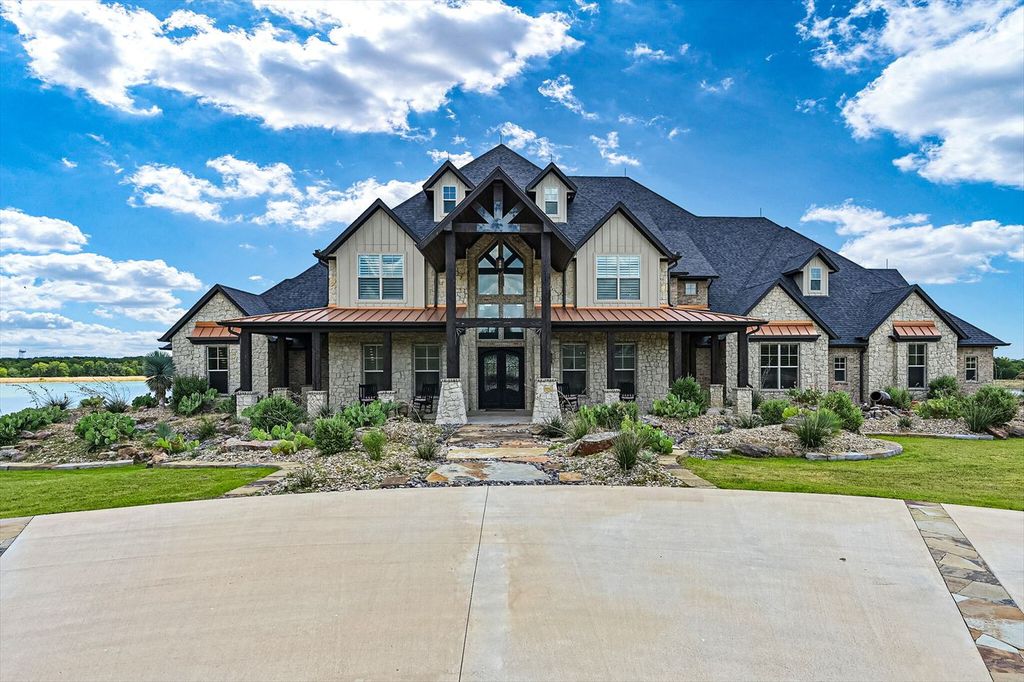430 Chaparall Road Home in Ferris, Texas. Discover this breathtaking custom lake home nestled on 514 secluded acres, just 15 minutes south of Dallas. Meticulously constructed with stunning lake views from every room, this home features vaulted ceilings, a chef's dream kitchen, luxurious owner's suite, formal dining, study, and more. 