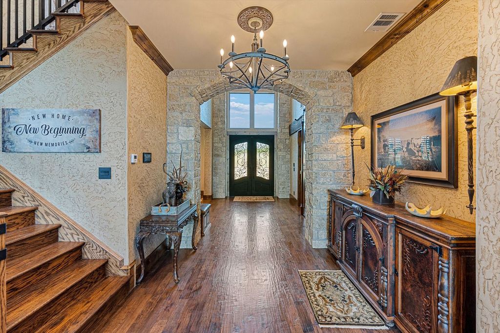 430 Chaparall Road Home in Ferris, Texas. Discover this breathtaking custom lake home nestled on 514 secluded acres, just 15 minutes south of Dallas. Meticulously constructed with stunning lake views from every room, this home features vaulted ceilings, a chef's dream kitchen, luxurious owner's suite, formal dining, study, and more. 