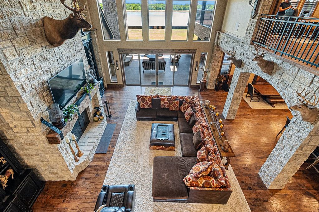 430 Chaparall Road Home in Ferris, Texas. Discover this breathtaking custom lake home nestled on 514 secluded acres, just 15 minutes south of Dallas. Meticulously constructed with stunning lake views from every room, this home features vaulted ceilings, a chef's dream kitchen, luxurious owner's suite, formal dining, study, and more. 