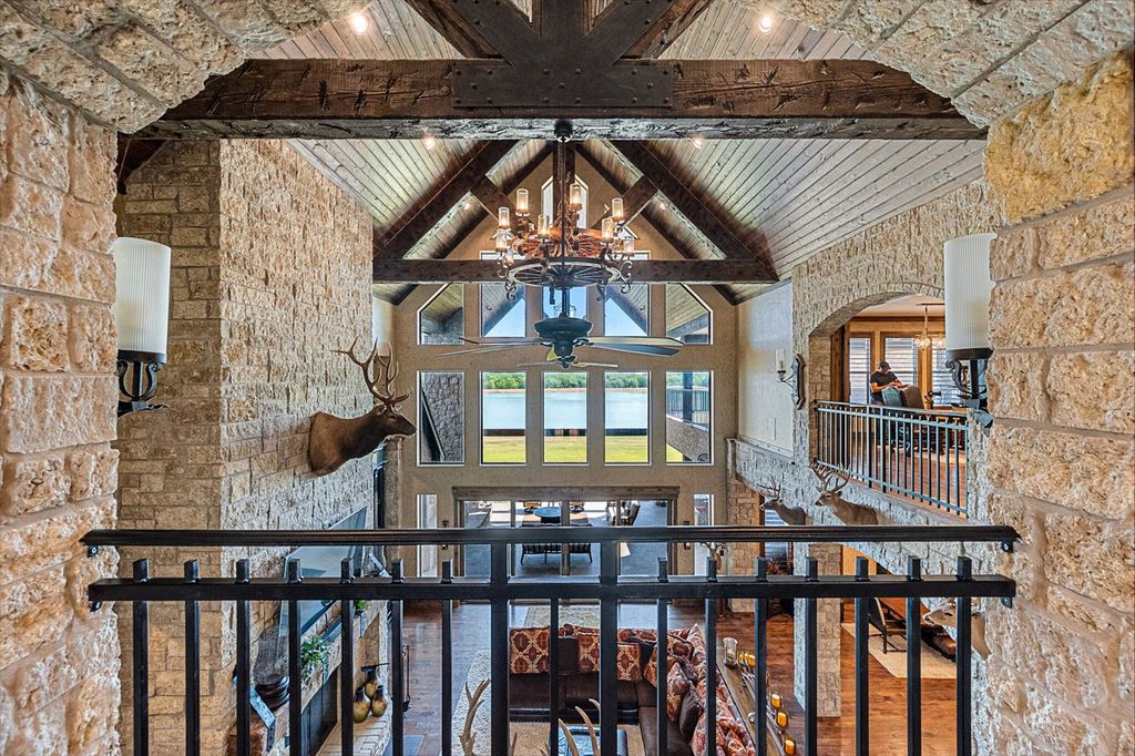 430 Chaparall Road Home in Ferris, Texas. Discover this breathtaking custom lake home nestled on 514 secluded acres, just 15 minutes south of Dallas. Meticulously constructed with stunning lake views from every room, this home features vaulted ceilings, a chef's dream kitchen, luxurious owner's suite, formal dining, study, and more. 