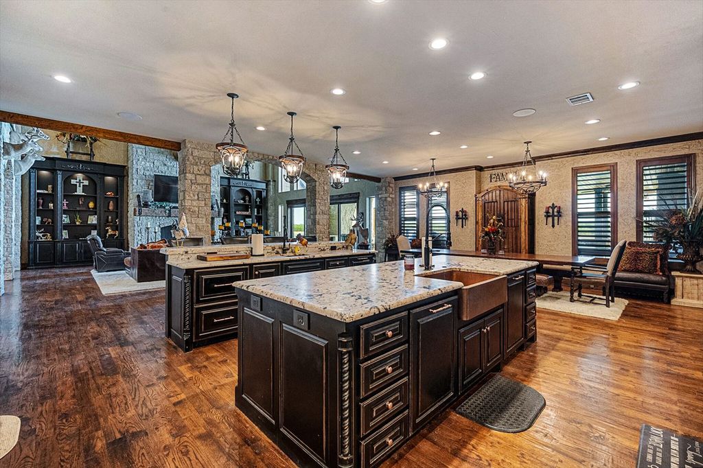 430 Chaparall Road Home in Ferris, Texas. Discover this breathtaking custom lake home nestled on 514 secluded acres, just 15 minutes south of Dallas. Meticulously constructed with stunning lake views from every room, this home features vaulted ceilings, a chef's dream kitchen, luxurious owner's suite, formal dining, study, and more. 