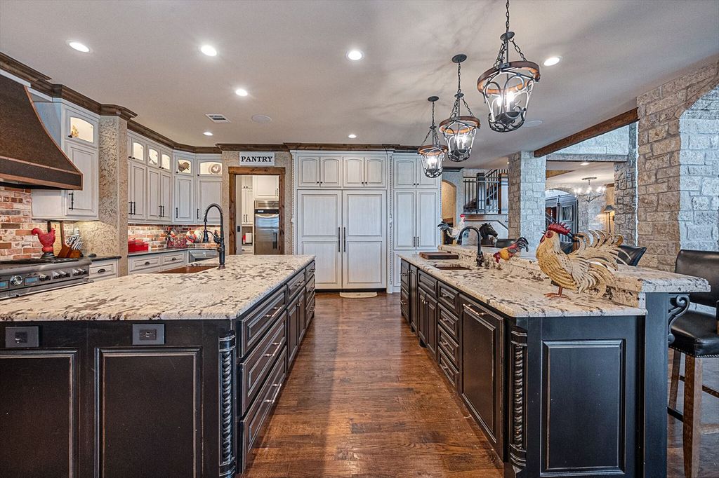 430 Chaparall Road Home in Ferris, Texas. Discover this breathtaking custom lake home nestled on 514 secluded acres, just 15 minutes south of Dallas. Meticulously constructed with stunning lake views from every room, this home features vaulted ceilings, a chef's dream kitchen, luxurious owner's suite, formal dining, study, and more. 