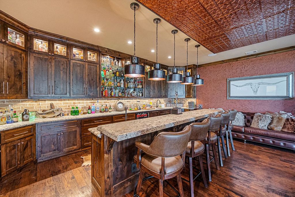 430 Chaparall Road Home in Ferris, Texas. Discover this breathtaking custom lake home nestled on 514 secluded acres, just 15 minutes south of Dallas. Meticulously constructed with stunning lake views from every room, this home features vaulted ceilings, a chef's dream kitchen, luxurious owner's suite, formal dining, study, and more. 