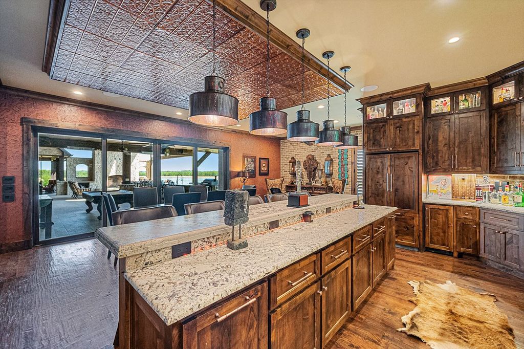 430 Chaparall Road Home in Ferris, Texas. Discover this breathtaking custom lake home nestled on 514 secluded acres, just 15 minutes south of Dallas. Meticulously constructed with stunning lake views from every room, this home features vaulted ceilings, a chef's dream kitchen, luxurious owner's suite, formal dining, study, and more. 