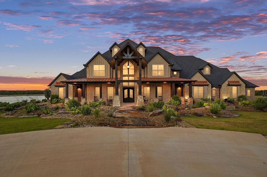 430 Chaparall Road Home in Ferris, Texas. Discover this breathtaking custom lake home nestled on 514 secluded acres, just 15 minutes south of Dallas. Meticulously constructed with stunning lake views from every room, this home features vaulted ceilings, a chef's dream kitchen, luxurious owner's suite, formal dining, study, and more. 