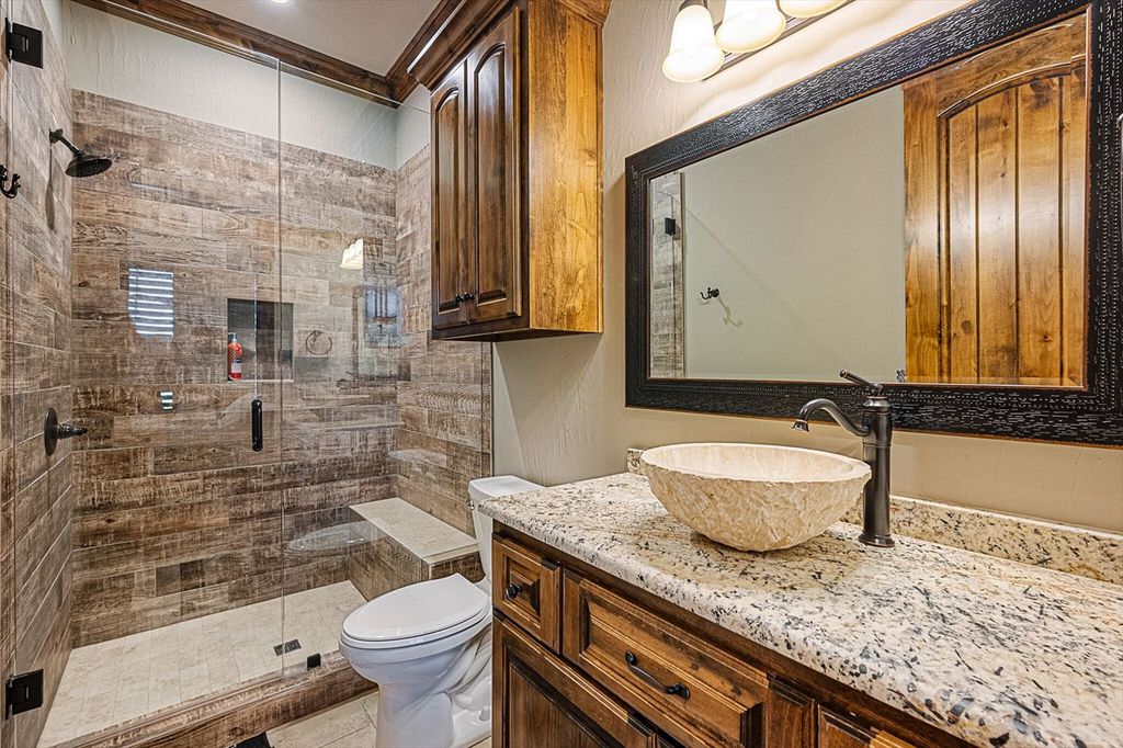 430 Chaparall Road Home in Ferris, Texas. Discover this breathtaking custom lake home nestled on 514 secluded acres, just 15 minutes south of Dallas. Meticulously constructed with stunning lake views from every room, this home features vaulted ceilings, a chef's dream kitchen, luxurious owner's suite, formal dining, study, and more. 