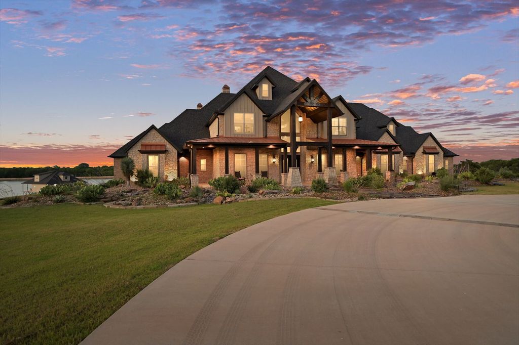 430 Chaparall Road Home in Ferris, Texas. Discover this breathtaking custom lake home nestled on 514 secluded acres, just 15 minutes south of Dallas. Meticulously constructed with stunning lake views from every room, this home features vaulted ceilings, a chef's dream kitchen, luxurious owner's suite, formal dining, study, and more. 