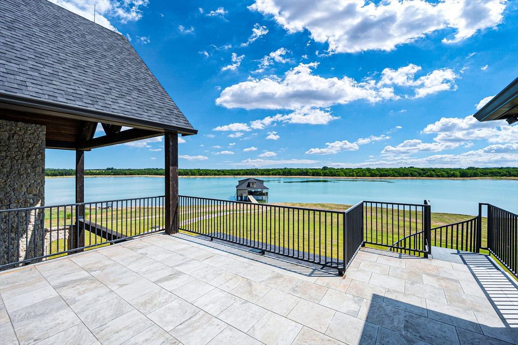 430 Chaparall Road Home in Ferris, Texas. Discover this breathtaking custom lake home nestled on 514 secluded acres, just 15 minutes south of Dallas. Meticulously constructed with stunning lake views from every room, this home features vaulted ceilings, a chef's dream kitchen, luxurious owner's suite, formal dining, study, and more. 