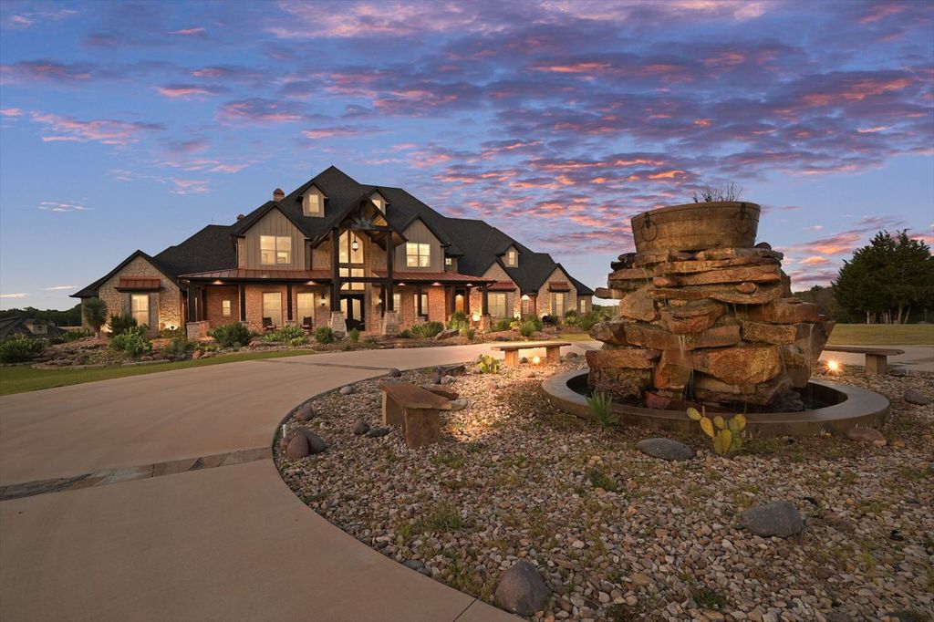 430 Chaparall Road Home in Ferris, Texas. Discover this breathtaking custom lake home nestled on 514 secluded acres, just 15 minutes south of Dallas. Meticulously constructed with stunning lake views from every room, this home features vaulted ceilings, a chef's dream kitchen, luxurious owner's suite, formal dining, study, and more. 
