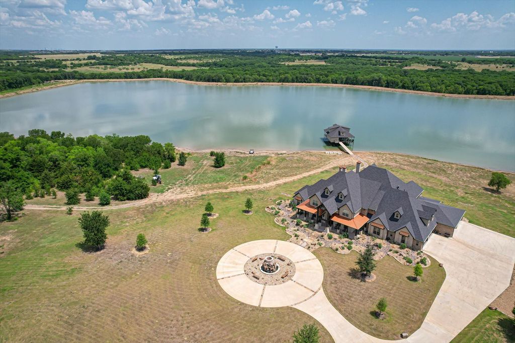 430 Chaparall Road Home in Ferris, Texas. Discover this breathtaking custom lake home nestled on 514 secluded acres, just 15 minutes south of Dallas. Meticulously constructed with stunning lake views from every room, this home features vaulted ceilings, a chef's dream kitchen, luxurious owner's suite, formal dining, study, and more. 