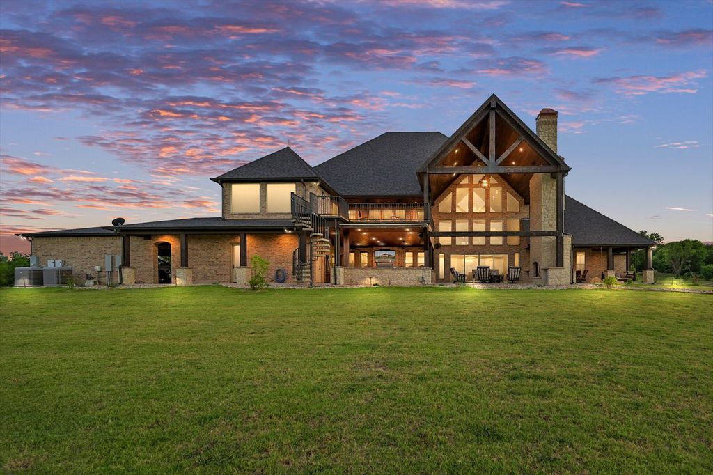430 Chaparall Road Home in Ferris, Texas. Discover this breathtaking custom lake home nestled on 514 secluded acres, just 15 minutes south of Dallas. Meticulously constructed with stunning lake views from every room, this home features vaulted ceilings, a chef's dream kitchen, luxurious owner's suite, formal dining, study, and more. 