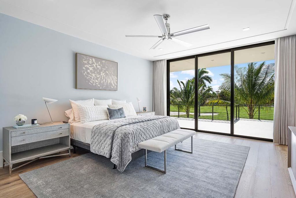 This prestigious Signature Estate within the Royal Palm Yacht & Country Club offers breathtaking views of lush golf course fairways.