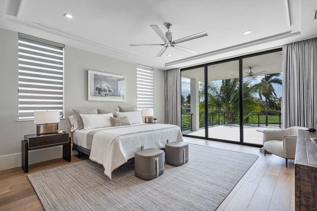 This prestigious Signature Estate within the Royal Palm Yacht & Country Club offers breathtaking views of lush golf course fairways.