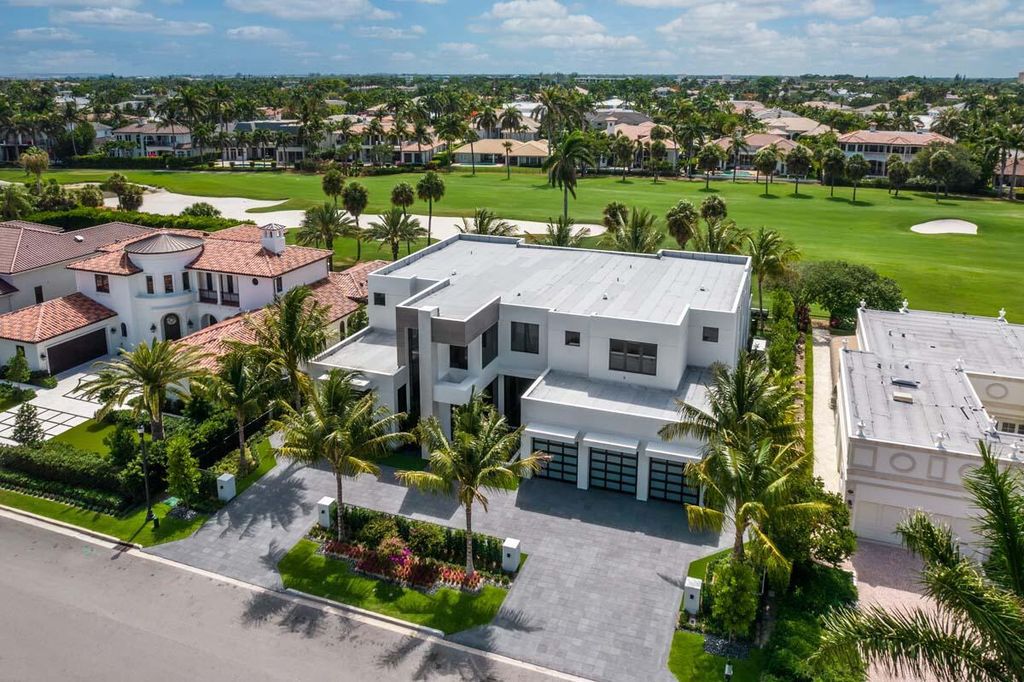 This prestigious Signature Estate within the Royal Palm Yacht & Country Club offers breathtaking views of lush golf course fairways.