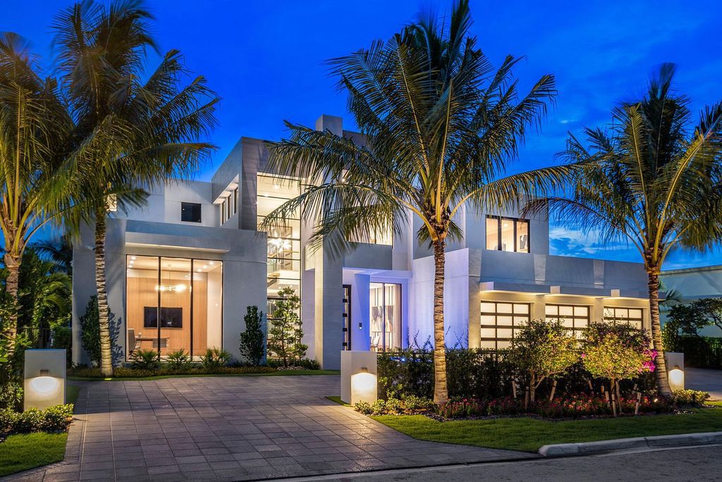 This prestigious Signature Estate within the Royal Palm Yacht & Country Club offers breathtaking views of lush golf course fairways.