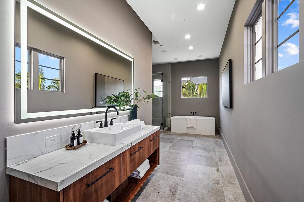 Originally crafted in 2003 by Dan Swanson of Addison Development, this newly remastered intracoastal estate seamlessly blends classic Spanish design with California chic.