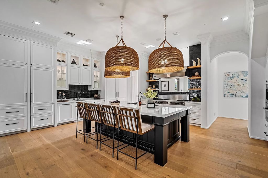 Originally crafted in 2003 by Dan Swanson of Addison Development, this newly remastered intracoastal estate seamlessly blends classic Spanish design with California chic.