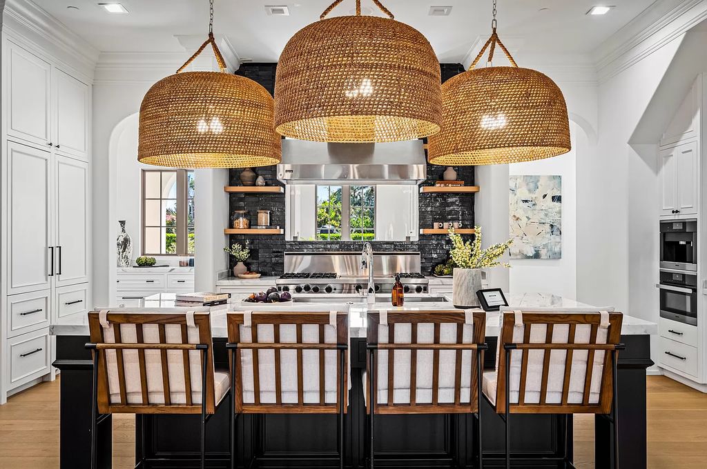 Originally crafted in 2003 by Dan Swanson of Addison Development, this newly remastered intracoastal estate seamlessly blends classic Spanish design with California chic.