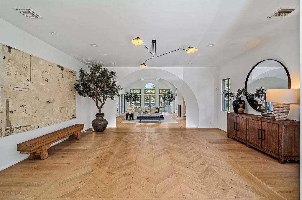 Originally crafted in 2003 by Dan Swanson of Addison Development, this newly remastered intracoastal estate seamlessly blends classic Spanish design with California chic.