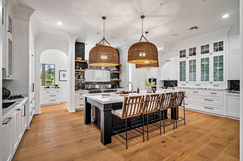 Originally crafted in 2003 by Dan Swanson of Addison Development, this newly remastered intracoastal estate seamlessly blends classic Spanish design with California chic.