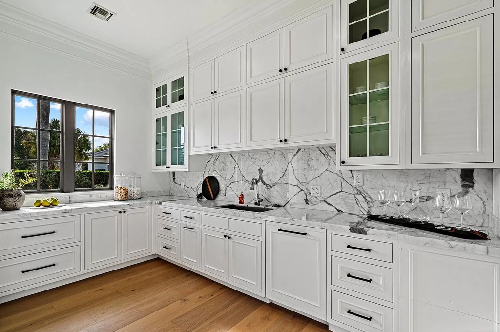 Originally crafted in 2003 by Dan Swanson of Addison Development, this newly remastered intracoastal estate seamlessly blends classic Spanish design with California chic.