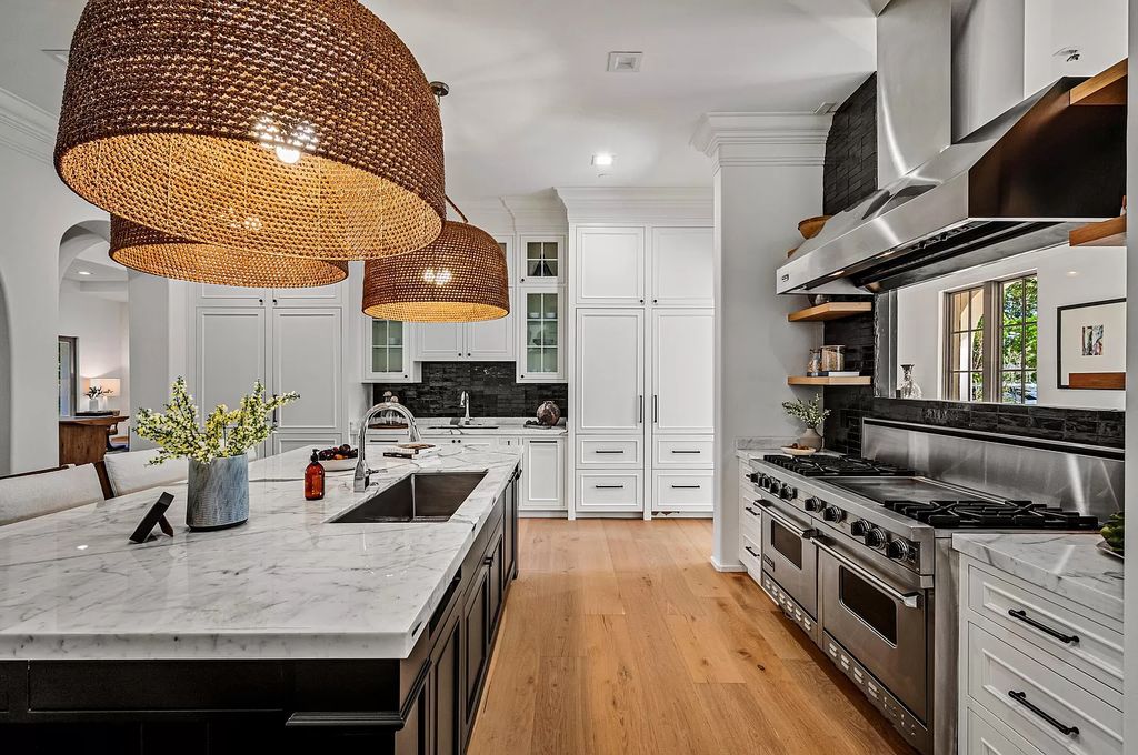 Originally crafted in 2003 by Dan Swanson of Addison Development, this newly remastered intracoastal estate seamlessly blends classic Spanish design with California chic.
