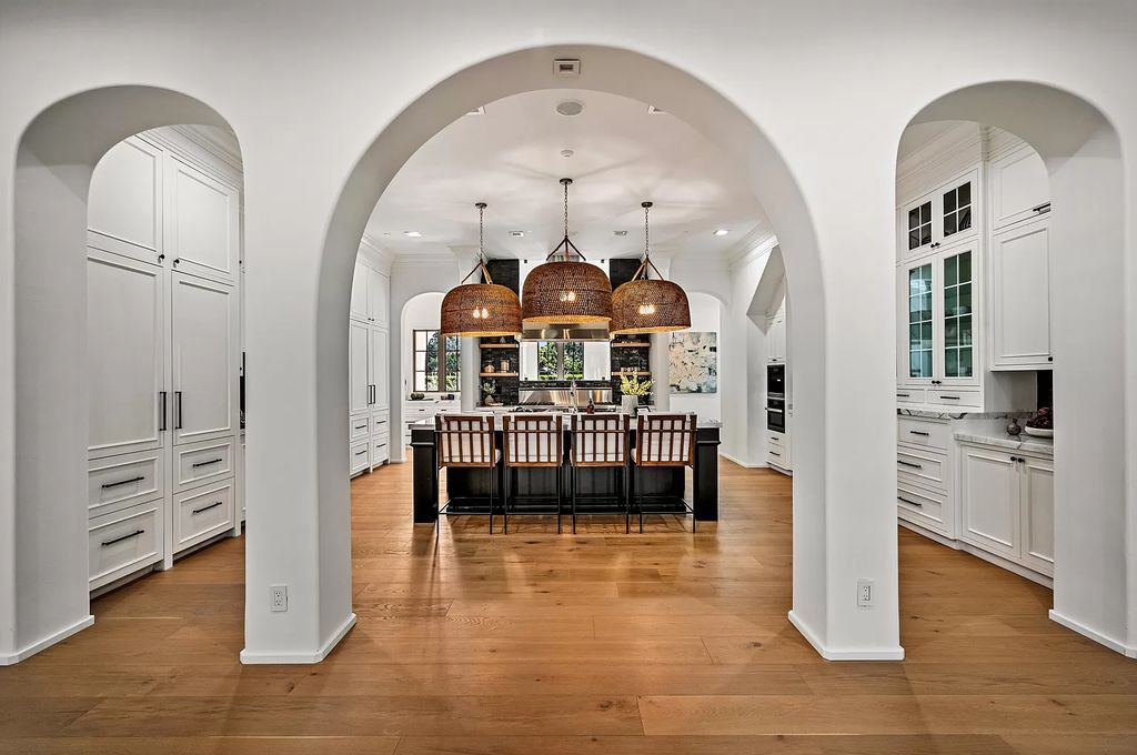 Originally crafted in 2003 by Dan Swanson of Addison Development, this newly remastered intracoastal estate seamlessly blends classic Spanish design with California chic.
