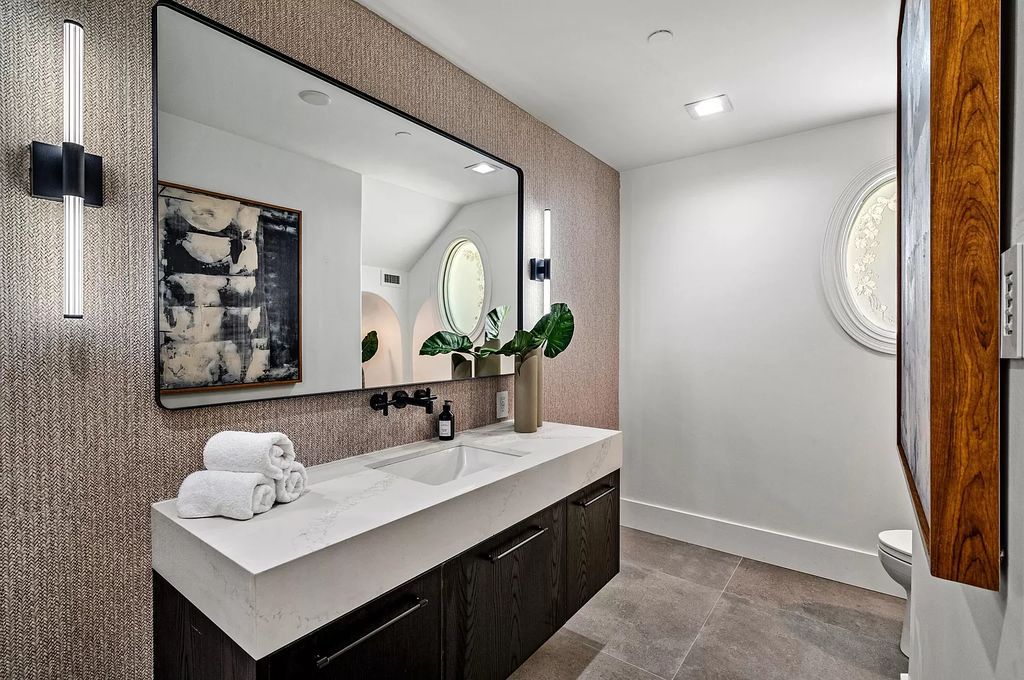 Originally crafted in 2003 by Dan Swanson of Addison Development, this newly remastered intracoastal estate seamlessly blends classic Spanish design with California chic.