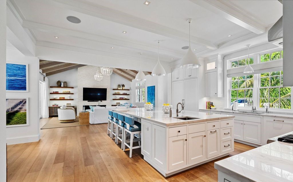 Indulge in luxurious coastal living at 156 Seagate, a meticulously designed haven nestled on Palm Beach Island's coveted North End.