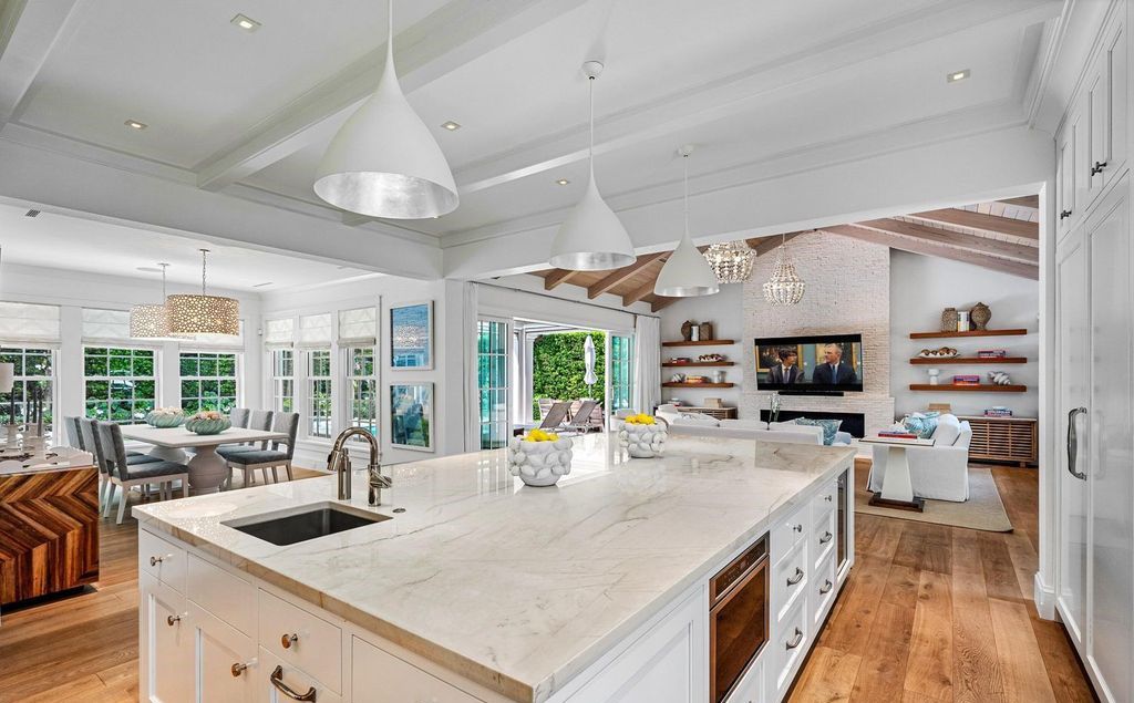 Indulge in luxurious coastal living at 156 Seagate, a meticulously designed haven nestled on Palm Beach Island's coveted North End.