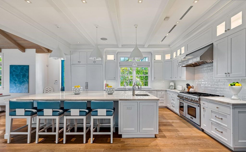 Indulge in luxurious coastal living at 156 Seagate, a meticulously designed haven nestled on Palm Beach Island's coveted North End.