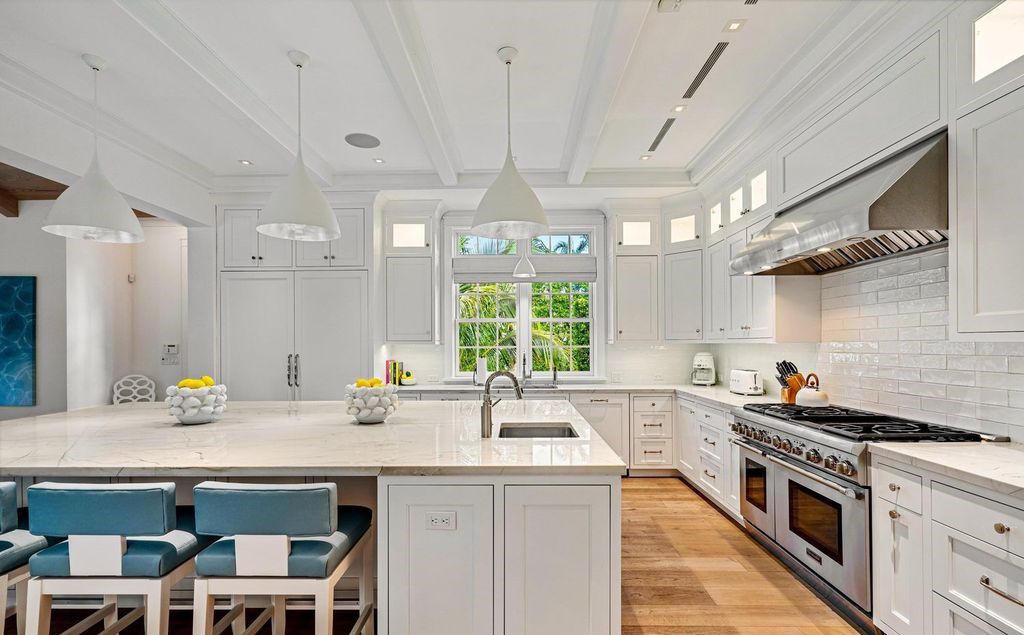 Indulge in luxurious coastal living at 156 Seagate, a meticulously designed haven nestled on Palm Beach Island's coveted North End.